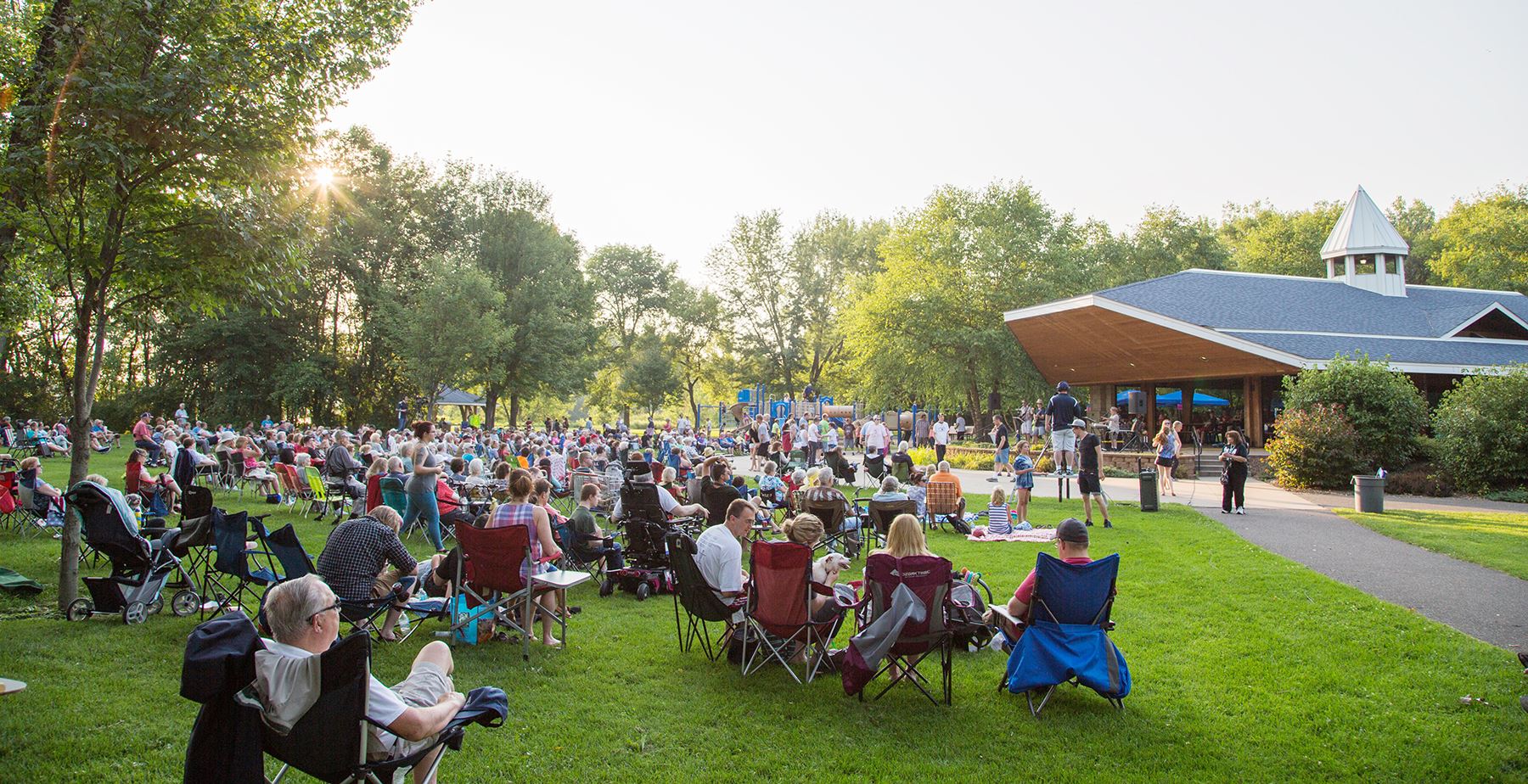 The community gathers for a summer concert at the Coon Rapids Dam